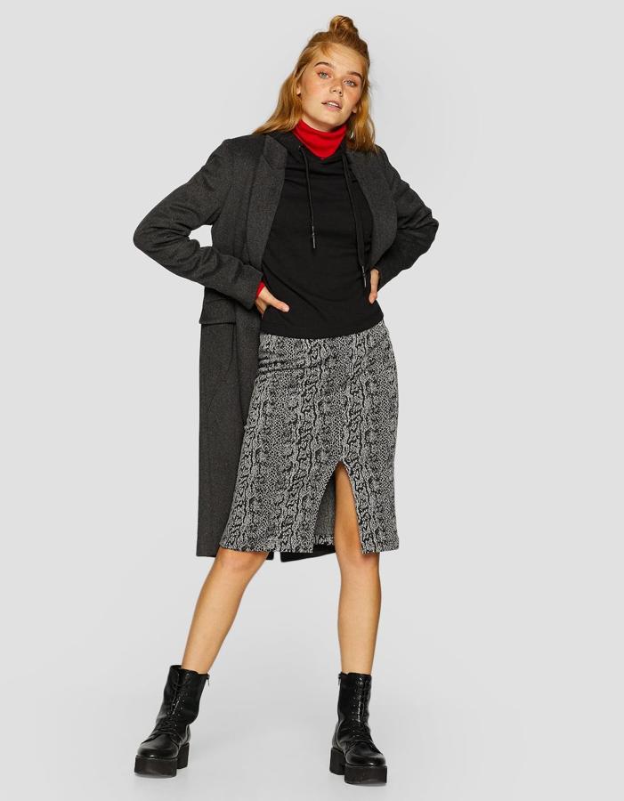 20 faldas y vestidos para llevar con las botas de moda del otoño