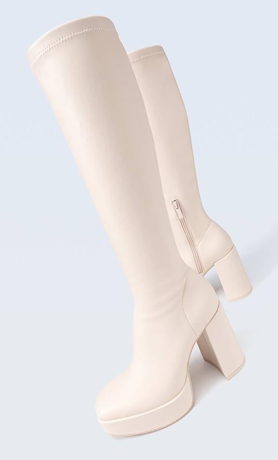 Las botas blancas low cost que más se llevan en el street style de otoño-invierno