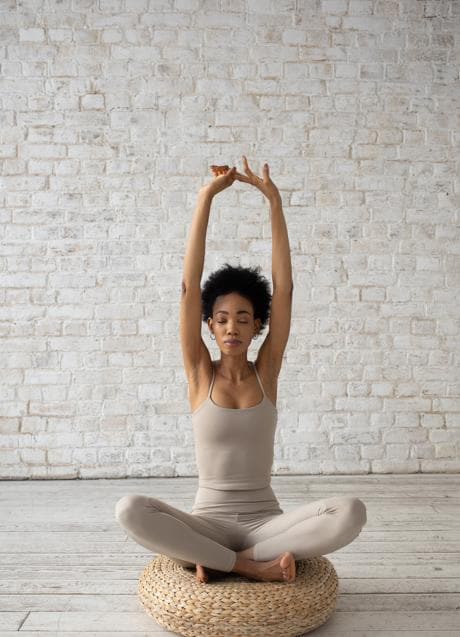 Woman doing yoga/PEXELS